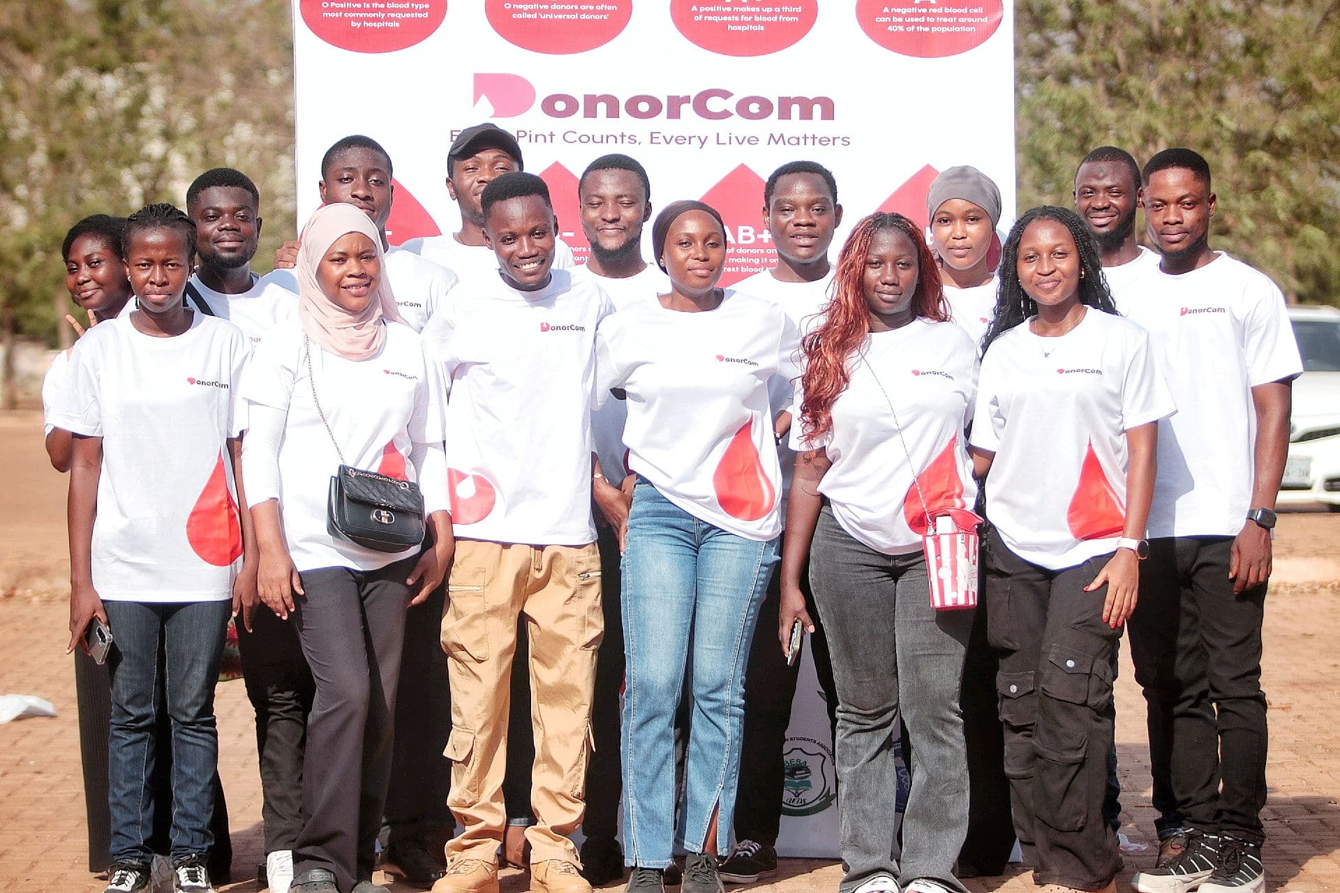 DonorCom volunteers standing together during a community activation